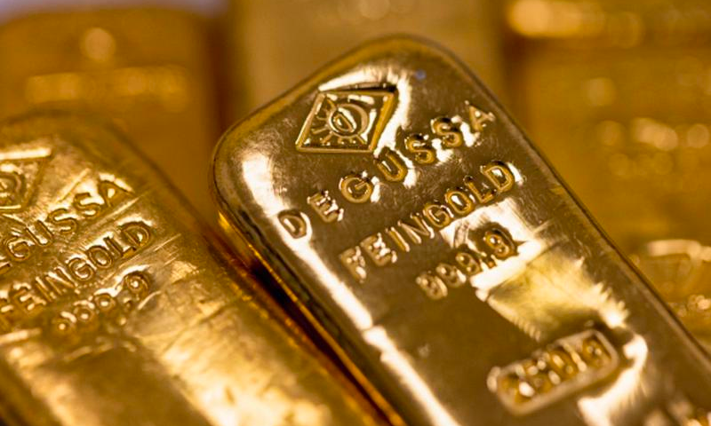 giá vàng đã đạt đỉnh cao kỷ lục là 2.135,4 USD/ounce vào phiên giao dịch ngày 4/12